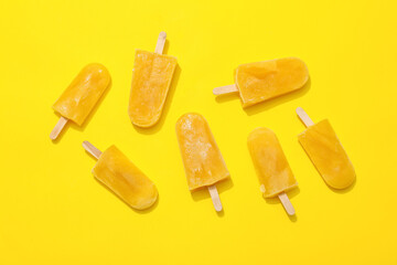 Tasty mango ice cream on color background