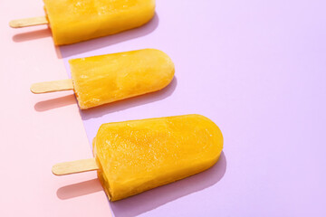 Tasty mango ice cream on color background
