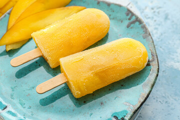 Plate with mango ice cream on color background