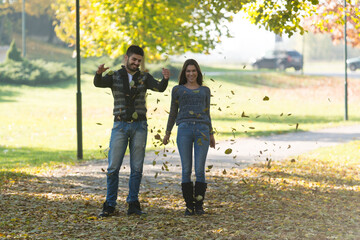 Couple Enjoying Fall in the Park Outside