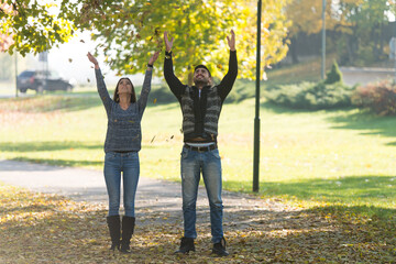 Young Couple Enjoying In Autumn Forest