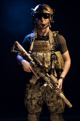Fototapeta premium Special forces soldier with rifle on black background