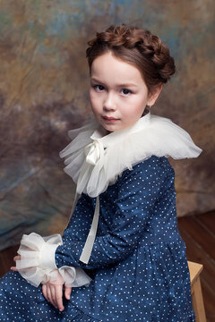 Portrait of girl with ruff collar. Art photography