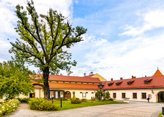 Fototapeta na wymiar Zywiec Castle main courtyard with iconic well within historic park in Zywiec old town city center in Silesia region of Poland