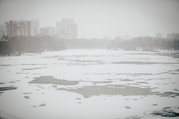 Snowy city with poor visibility, snowstorm on the street.