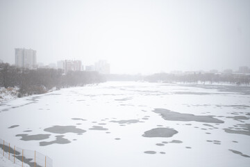 Snowy city with poor visibility, snowstorm on the street.