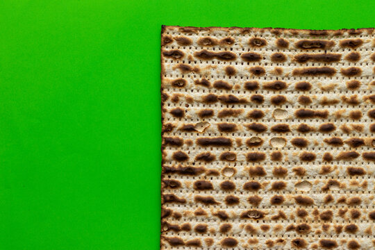 Close-up of matzah - bread for the Jewish Passover, on a green background