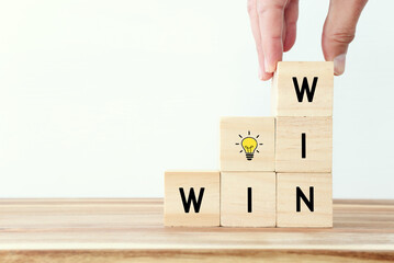 Wooden cubes stack with the text win-win-situation. Strategy and business concept