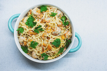 tasty italian homemade pasta with chanterelles, turkey meat balls and creamy sauce