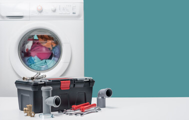 Plumber toolbox near washing machine