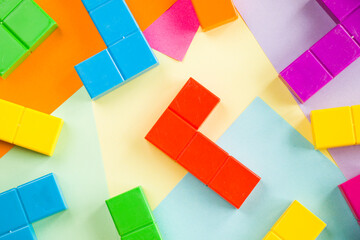 Colorful puzzle cubes background, geometric figures, table game