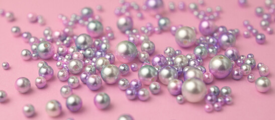 Naklejka na ściany i meble Closeup of gradient pearls on pink paper