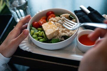 Healthy breakfast bowl with porridge and fresh vegetable salad