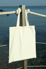 Blank eco bag on pier on the seashore