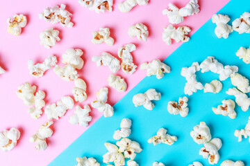 Popcorn pattern on blue and pink background close-up, top view