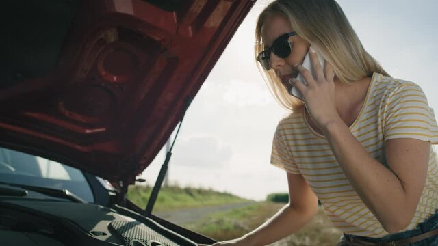 Video of woman calling her insurance after a car breakdown Shot with RED helium camera in 8K.