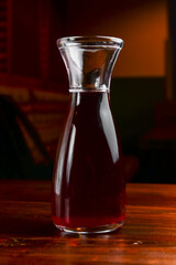 Closeup of mulled wine, in a glass over Traditional Ukrainian tablecloth. Christmas time, winter time.