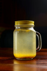Ginger tea with lemon and mint over black background. Ukrainian cuisine concept, Christmas time.