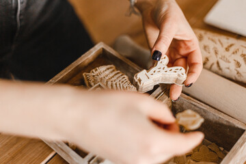Female hands sculpt beautiful plates from clay at a lesson in a pottery workshop