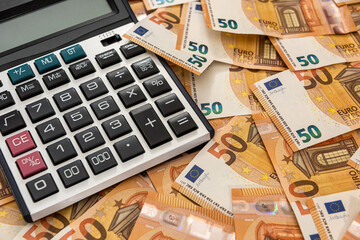 business and exchange concept with euro cash and calculator