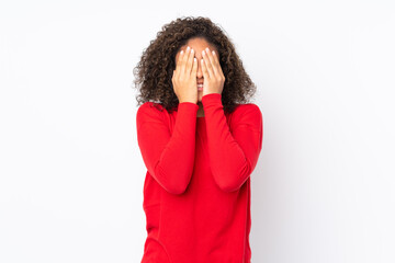 Young African American woman isolated on background covering eyes by hands