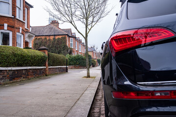 Car parked on British street of urban housing 