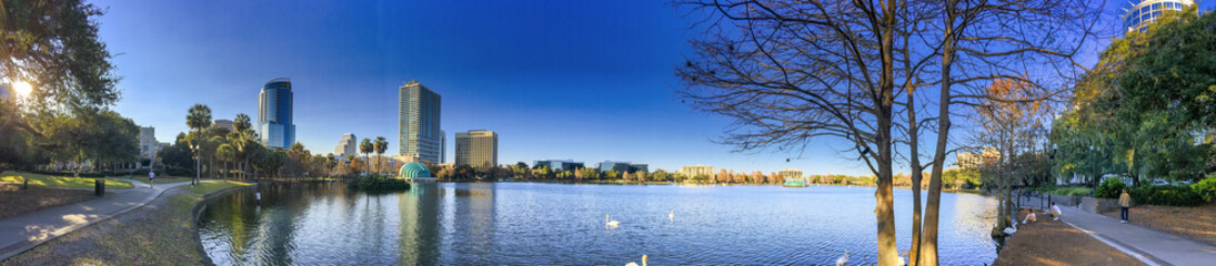 Orlando, Florida. Park along Lake Eola and city skyline at winter sunset