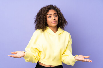 Young African American woman isolated on background having doubts