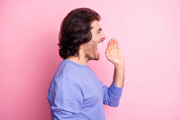 Profile side photo of loud funky handsome young man hold hand mouth talk scream information isolated on pink color background