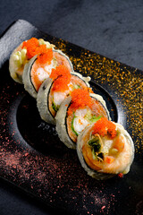fried sushi  on the dark background