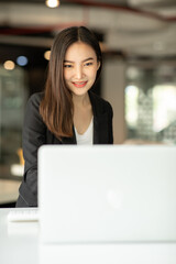 Asian young Business woman working in office with documents