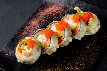 fried sushi  on the dark background