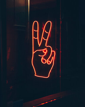 Two finger peace neon sign