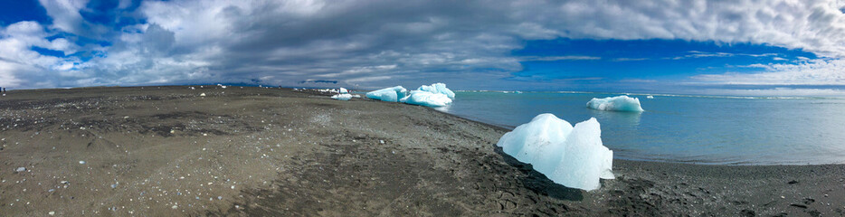 Jokulsarlon Icebergs along the beach, panoramic view of Iceland coastline