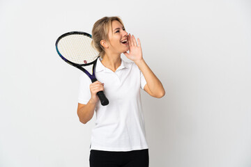 Young Russian woman tennis player isolated on white background shouting with mouth wide open to the side