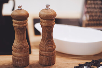 Wooden salt and pepper shaker set in the kitchen, eco-friendly product and home decor idea © Studio ANNA