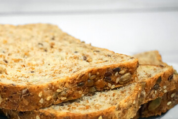 Sprouted Whole Grains Sliced Bread close up. Healthy eating concept.