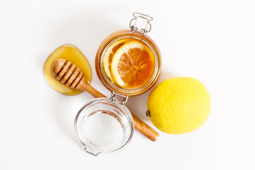 Lemon and honey on white stone background