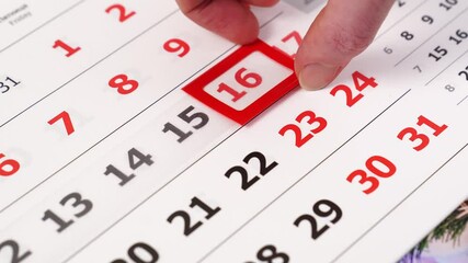 hand shifts the red frame on the calendar from one number to another. 