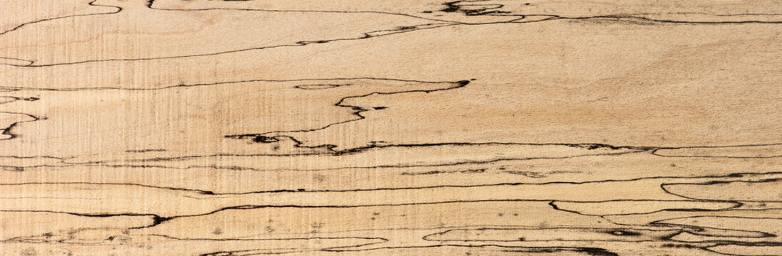 Spalted maple texture, with unique and distinctive black lines. Sought after wood for guitar making. 