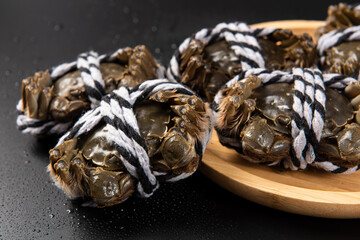 Raw Chinese mitten crab, shanghai hairy crab isolated on black background.