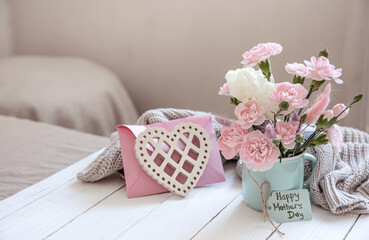 Cozy still life for Mother's Day with fresh flowers and decor details.