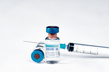 Covid-19 vaccination with vaccine bottle and syringe injection tool for coronavirus immunization treatment.