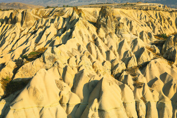 Fototapeta na wymiar Valley with the sandy mountains of Cappadocia. Fantastic landscape.