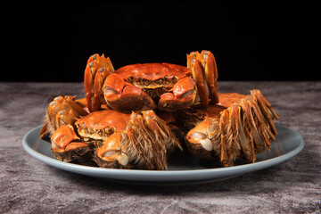 steamed chinese mitten crab, shanghai hairy crab close up on plate © zhikun sun