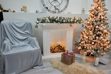 Cozy sofa and Christmas tree in the living room. The background of the photo studio. Photo shoot location in New Year