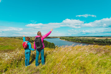 Fototapeta na wymiar mother and son enjoy travel in nature, family hiking