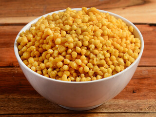 Kara Boondi or Bundi - A traditional Indian namkeen / snack and important Chat item, Served in a bowl. selective focus