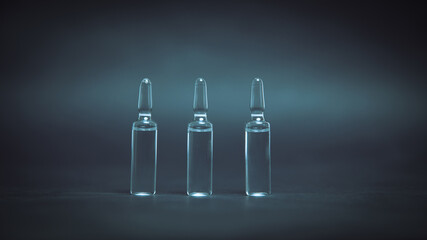 medical glass ampoules on a dark background.