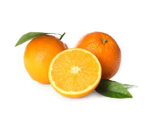 Fototapeta na wymiar Cut and whole fresh ripe oranges with green leaves on white background